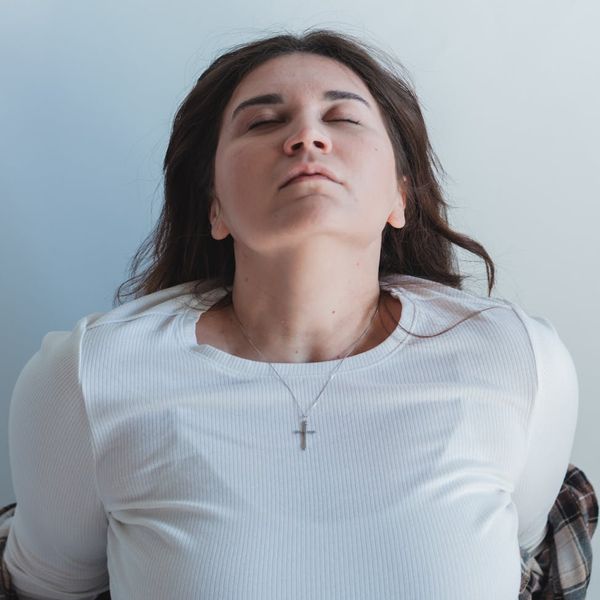 Person meditating in a serene environment, symbolizing mental clarity and peace.